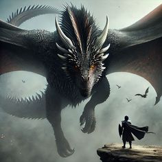 a man standing on top of a cliff next to a dragon