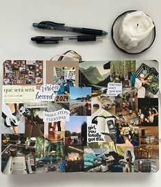 a notebook with many pictures and pens on it