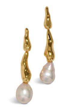 Cultured pearls are droplets of light in hammered drop earrings inspired by molten metal. 1 3/4" drop; 1/4" width Post back 14k-gold plate/cultured pearl Imported Modern Gold Long Drop Pearl Earrings, Gold Hammered Dangle Pearl Earrings, Wedding Skincare, Cold Weather Shoes, Molten Metal, Womens Watches Luxury, Sneaker Jewelry, Makeup Gift, Alexis Bittar