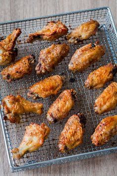 chicken wings on a wire rack ready to be cooked and put in the oven for consumption