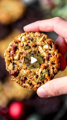 a person holding a cookie in their hand