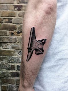 a man's arm with a black and white airplane tattoo on it