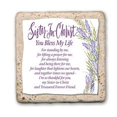 a stone with the words sister in christ and lavenders on it, sitting next to a