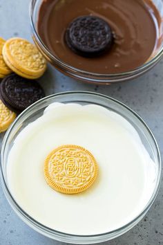 two bowls filled with oreo cookies next to each other