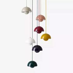 several different colored lamps hanging from the ceiling