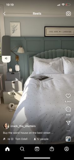 the bed is made with white sheets and pillows