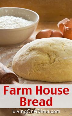 a loaf of bread sitting on top of a wooden table next to eggs and flour