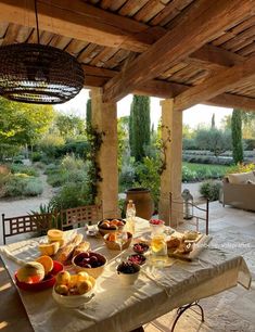 an outdoor dining area with food on the table