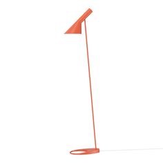 an orange floor lamp on a white background with the light turned on and one arm bent down