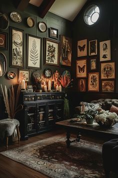 a living room filled with furniture and lots of pictures on the wall next to a fire place