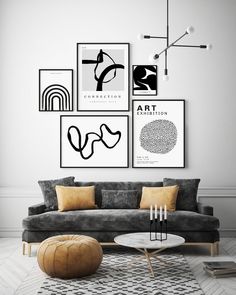 a black and white living room with art on the wall