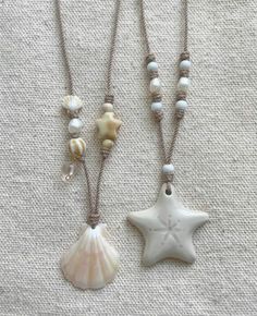 two necklaces with seashells and pearls on them