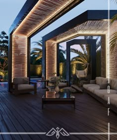 an outdoor living area with couches, tables and lamps on the deck at dusk