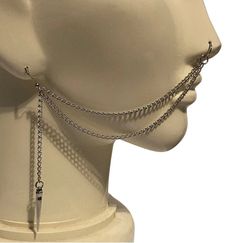 Edgy cool 2-strand nose chain with a medium spike charm hanging from a chain. Made with fish hook earring and jump rings. The color choices are Dark Silver (steel, as pictured), Gold, Gunmetal, Black (limited quantity) or Bright Silver. (See picture #3 for chain colors). This comes with either no nose hoop, a clasp on the end, 1 seamless hoop, or 1 Non-Pierced Illusion Hoop. The top chain measures 5 inches. The bottom chain measures 5 3/4 inches. The dark silver chain is stainless steel, the gol Nose To Ear Chain, Nose Chain, Chains Aesthetic, Nose Earrings, Ear Chain, Unique Faces, Nose Hoop, Fish Hook Earrings, Funky Jewelry