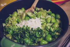 green beans and onions are being cooked in a skillet