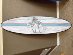 a surfboard is hanging on the wall