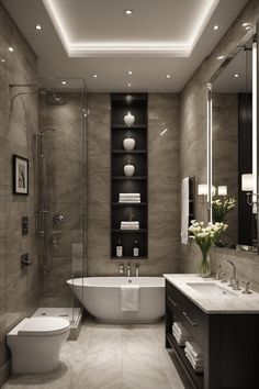 a bathroom with a tub, sink, toilet and mirror above it is a large white bathtub next to a walk in shower