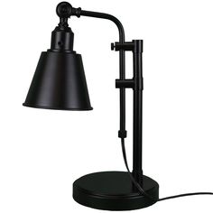 a black table lamp with an arm and a light on the side, next to it