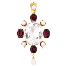 Some like it hot and dramatic which is an accurate description of this large 60ct Victorian Rock Crystal, Garnet and Natural Pearl Pendant. If that is not enough magic, add an original bale, six natural pearls and 11n cts of wine colored garnets. A statement piece indeed that beautifully made and has been cared for for 180 years. A jewel that more than hints and your daring personality and pride in your individuality. The healing properties of crystal are enlightenment and healing of the spirit Gold Antique Pendant, Some Like It Hot, Antique Pendant, Garnet Pendant, Garnet Necklace, Natural Pearl, Wine Colored, Rock Crystal, Beautifully Made