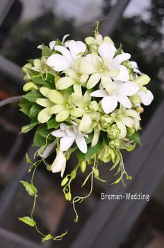 a bouquet of white flowers hanging from the ceiling