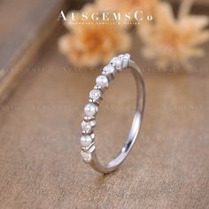 "🌸Vintage Pearl Ring Moissanite Wedding Band White Gold Natural Pearl Band Half Eternity Matching Band Stackable Ring Women Anniversary Gift **All rings are handmade and shipped in Australia. If you don't like the stone in the picture, please contact me to change it to ANY STONE you like. Check the Opal & Pearl band: https://www.etsy.com/listing/1449789491 Check the Bridal Sets show in pictures: https://www.etsy.com/listing/1448254349 https://www.etsy.com/listing/1441373278 https://www.etsy.com/listing/1441401230 Blue Opal and Moissanite Band: https://www.etsy.com/listing/1428755566 Opal and Sapphire Band: https://www.etsy.com/listing/749082855 Opal and Moissanite Curved Band: https://www.etsy.com/listing/806119969 🌸ITEM DETAILS Main Stone: Natural Opal and Moissanite, Round Cut Size: 2. Silver Stackable Wedding Eternity Band, Silver Half Eternity Diamond Ring For Wedding, Silver Stackable Wedding Diamond Ring, Silver Stackable Diamond Wedding Ring, Silver Half Eternity Wedding Band, Silver Half Eternity Band For Wedding, Stackable Diamond White Wedding Ring, Vintage Half Eternity Diamond Ring For Wedding, Vintage Half Eternity Diamond Wedding Ring