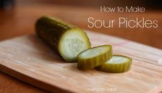 sliced cucumbers on a cutting board with the words how to make sour pickles