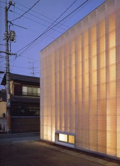 an image of a building that is made out of wood and has light coming from the windows