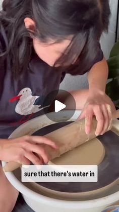 a woman rolling out dough on top of a wooden board