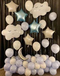 balloons and stars are arranged in the shape of a crescent, moon, and cloud