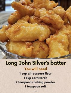 a bowl filled with fried food on top of a glass table next to a sign that says, long john silver's batter you will need i cup all purpose flour