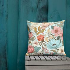 a pillow sitting on top of a wooden bench next to a green wall and blue wood