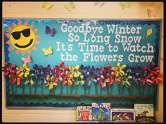 a bulletin board with flowers and the words goodbye winter so long snow it's time to watch the flowers grow