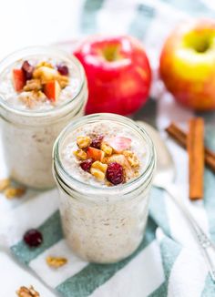 two mason jars filled with oatmeal and fruit