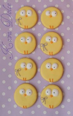 decorated cookies with eyes and bows are arranged in the shape of birds on a polka dot background