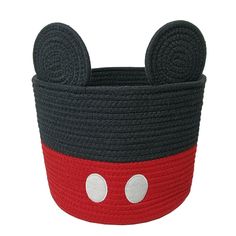 a black and red mickey mouse basket with ears on the front, one eye closed