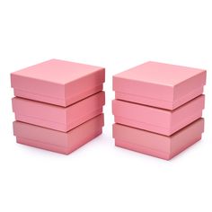 three pink boxes stacked on top of each other