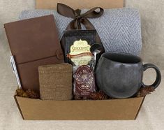 a gift box filled with coffee, tea and other items for someone's special occasion