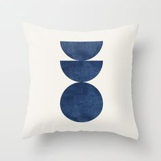 a white pillow with blue circles on it