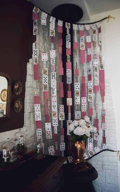 a room decorated with cards and flowers on the wall