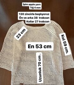 the size and measurements of a t - shirt for children, with labels on it