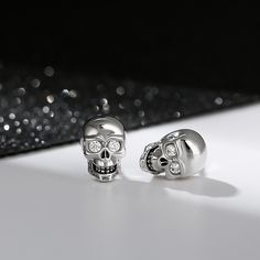 "We love the night. It's the only time I feel really alive." A striking set of earrings crafted in brilliant sterling silver inlaid with clear white stones. So cool, so unique. A unique statement piece that is great for everyday casual wear. It is also suitable to wear for Halloween to highlight your personality.Carat Weight: 0.1 ctStone Size: 1.8 mmStone Type: Jeulia® StoneNumber of Stones: 4 Stone Shape: RoundStone Color: Fancy BlackWeight: 3.43 gWidth: 7.3 mmHeight: 10.8 mmThickness: 5.2 mmMa Skeleton Knight, White Stones, Sterling Silver Stud Earrings, Clear White, Earring Crafts, Silver Stud Earrings, Skull Design, White Stone, Sterling Silver Studs