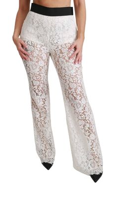 Crafted by Dolce & Gabbana, these high-waisted lace pants are designed to be paired with the matching jacket for an elegant wedding ensemble inspired by Bianca Jagger. Constructed with a blend of cotton and lined with stretch-silk shorts for coverage, they feature wide legs and scalloped hems for a touch of sophistication. Material: 46% Cotton, 11% Nylon/Polyamide, 43% Viscose Color: White High Waist with Side Zipper Closure Crafted with Logo Details Made in Italy High Heel Stiefel, Formal Loafers, Lace Pants, Corded Lace, Dolce E Gabbana, Dolce & Gabbana, Women Lace, Casual Boots, High Waisted Pants