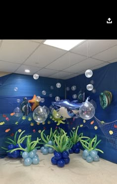 an aquarium themed room with fish and bubbles