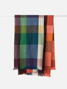 multicolored plaid scarf hanging on clothes line