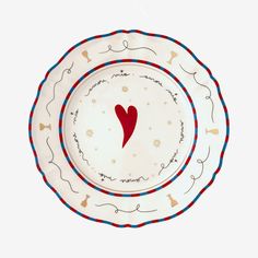 a plate with a red heart on it