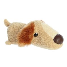 a brown and white stuffed dog laying down