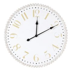 a white and gold clock with numbers on it's face is shown against a white background