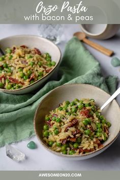 two bowls filled with pasta and peas on top of a table