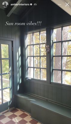 an empty room with two windows and a bench in front of the window that says sunroom vibes