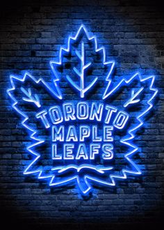 toronto maple leafs neon sign on a brick wall